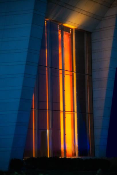Large colorful window of Northwestern Music School taken at night