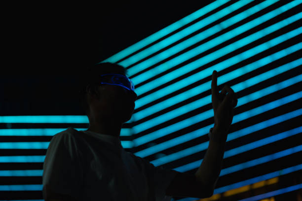 istock man wearing smart glowing glasses 1441912772