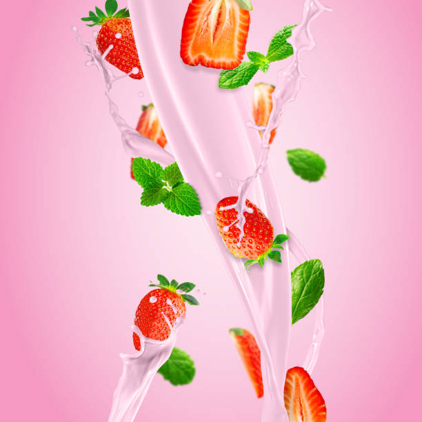 istock Fresh strawberries falling to make a delicious strawberry smoothie. pink background. 1441912809