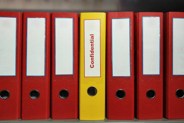 istock Confidential folders standing on archive shelf 1441912986