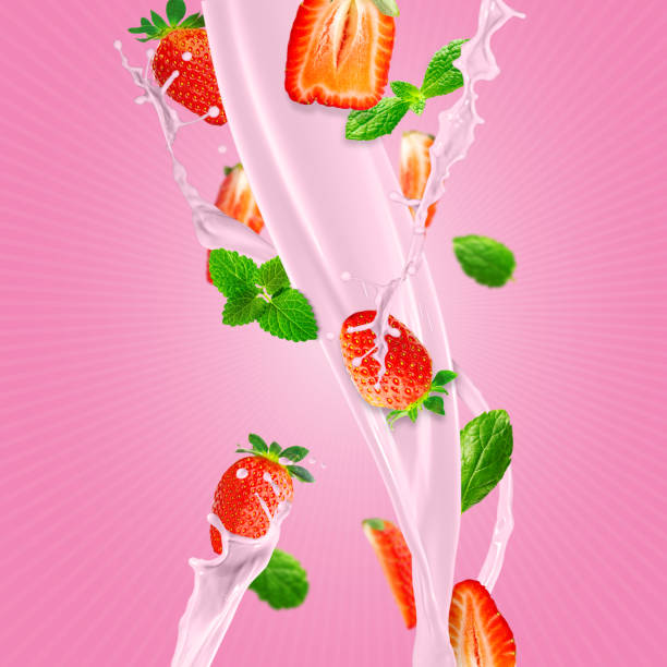istock Fresh strawberries falling to make a delicious strawberry smoothie. pink background. 1441914183