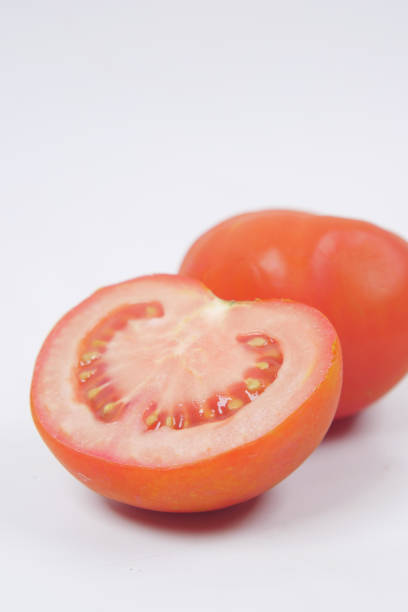 istock fresh tomato with water drop isolated on white 1441914605