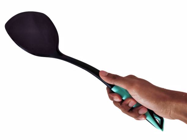 istock Hand holding spatula isolated on white background 1441914914