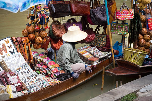 Siem Reap, Cambodia, Southeast Asia - “Old Market” know as “Psah Chat” (or “Psah Chas”)is located between Pub Street and the Western side of the Siem Reap River. This is an open-air market and is the oldest Khmer market in the province. This offers a glimpse of the real Cambodia. Travelers get the opportunity to try many authentic Khmer cuisine dishes like ‘Prahok” which is a type of fish paste and “Bai Sach Chrouk’ which is rice with pork slices and scrambled egg. It is a colorful and bustling market with market stalls on the outside and many food boats on the river.