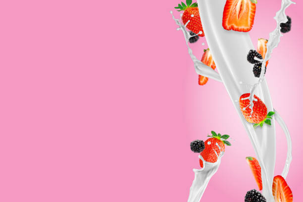 istock Fresh strawberries falling to make a delicious strawberry smoothie. pink background. 1441916506