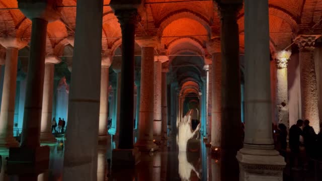 Silhouettes of tourists visiting Istanbul Basilica Cistern