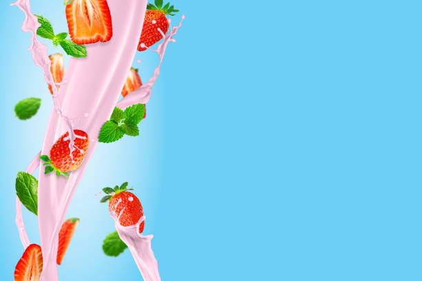 istock Fresh strawberries falling to make a delicious strawberry smoothie. blue background. 1441916842