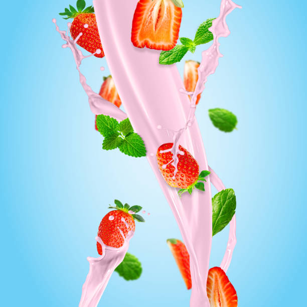 istock Fresh strawberries falling to make a delicious strawberry smoothie. blue background. 1441917148