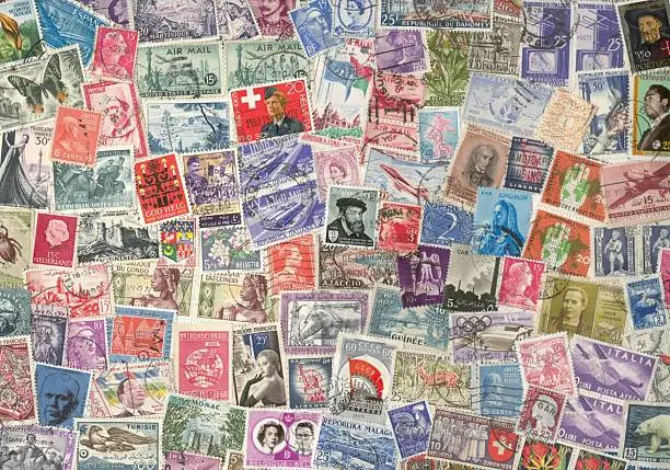 mosaic of old stamps form different counties of the world. A game with colors and designs