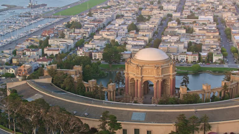 AERIAL Around the Palace of Fine Arts in San Francisco, California at sunset