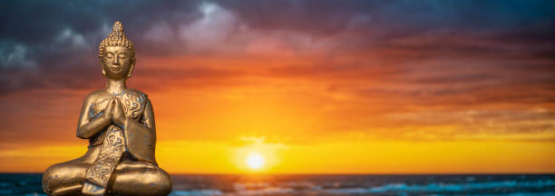istock golden buddhy against a sunrise or sunset 1441918673