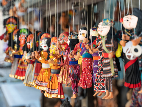 Traditional nepalese puppets on strings for sale in a souvenir shop in the Thamel area of Kathmandu city, Nepal.