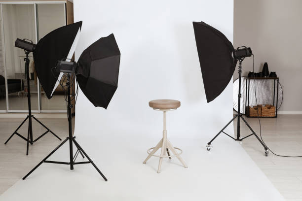 istock Empty stool surrounded by professional lighting equipment in photo studio 1441920178