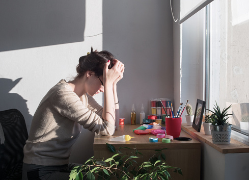 Woman suffering from Migraine Headache Symptoms