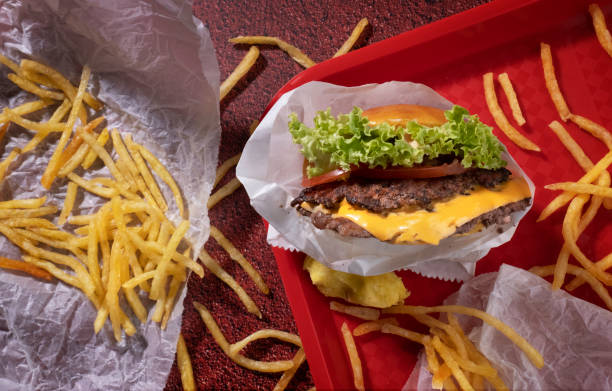 istock Smash burger and fries top view 1441920394