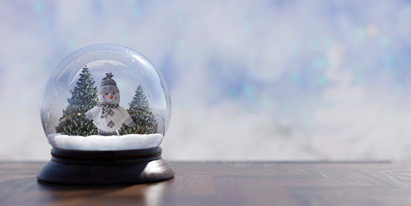 Snow globe with snowman. Christmas decoration on a table, copy space. Holiday greeting card template. 3d render