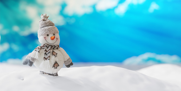 Snowman on snow, blue sky and winter snowy background, copy space. Christmas card template. 3d render