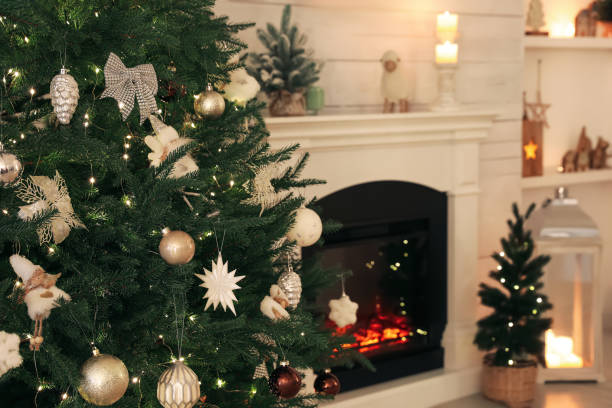 istock Stylish living room interior with decorated Christmas tree and fireplace 1441922439