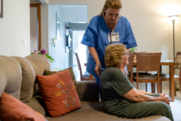istock Nurse visiting a senior woman at home. 1441922601