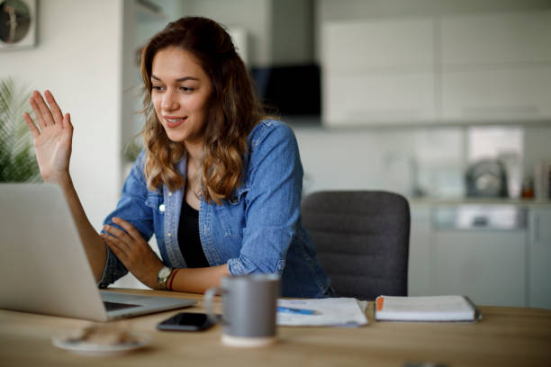 istock Young woman attends an online course at home 1441924756