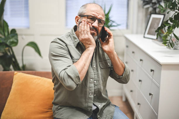 istock Mature adult man illness (toothache, mobile phone) 1441925284