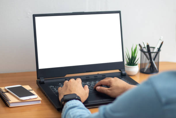istock man's hands working on laptop in front of white 1441927502