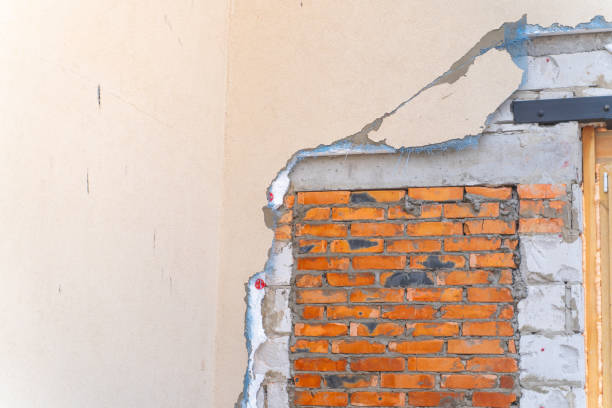 istock Dismantled polystyrene insulation and facade coating of a private house. Remodeling the exterior of the house 1441929552