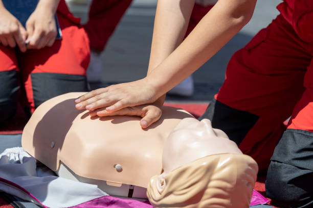 istock First aid course or Cardiopulmonary resuscitation training on CPR dummy 1441930843