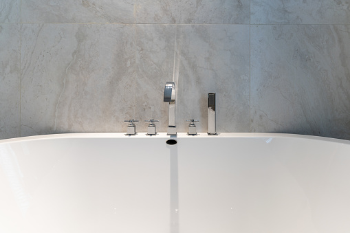 View of bath tube with day light from the window, very shallow depth of fieldView of bath tube with day light from the window, very shallow depth of field