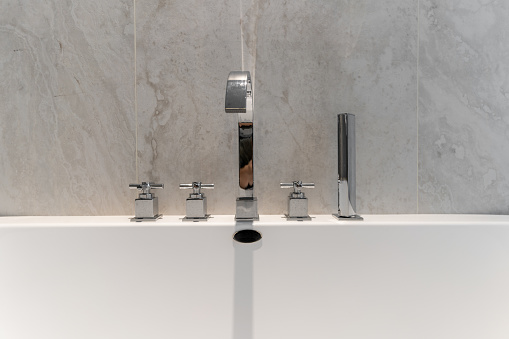 Stainless steel faucet in bathtub