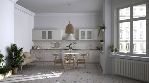 istock Retro white vintage kitchen with terrazzo marble floor and panoramic windows, dining room, round table with wooden chairs, potted plants, radiators, pendant lamp, cozy interior design 1441934790