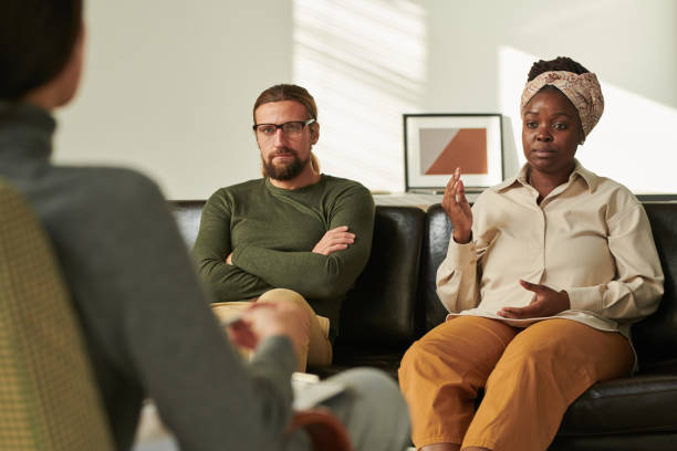 Couple talking about their problems to psychologist