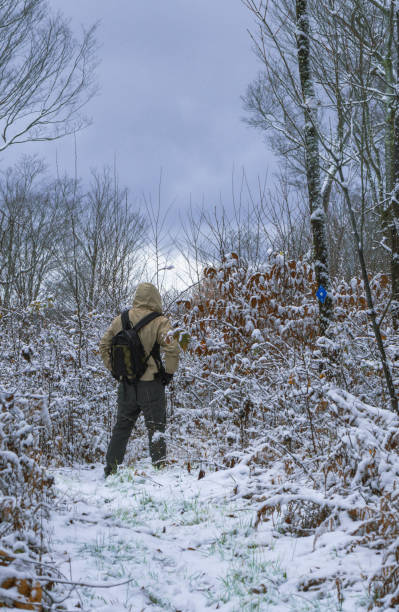istock Erly snow hike season man on a trail woods 1441937177