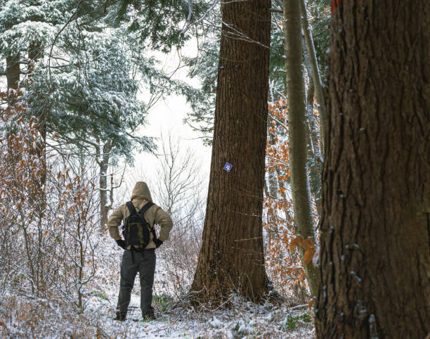 istock Erly snow hike season man on a trail woods 1441937256