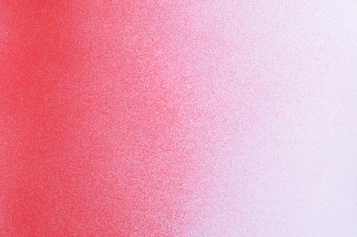 gradient red spray paint on a white paper background