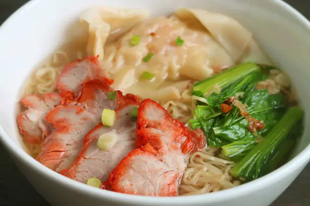 Photo of Mouthwatering Chinese Roasted Pork Egg Noodles and Wontons Soup with Vegetables