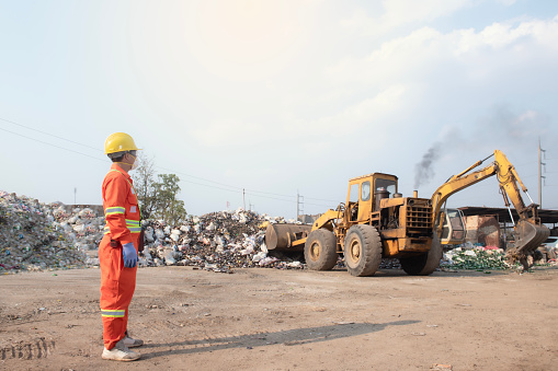 Worker controls the recycle waste separation of recyclable waste plants. Waste plastic bottles and other types of plastic waste.