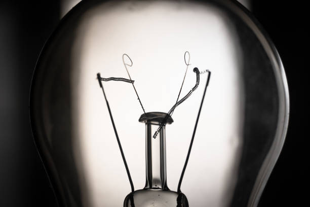 istock Broken filament of a light bulb close-up 1441938665
