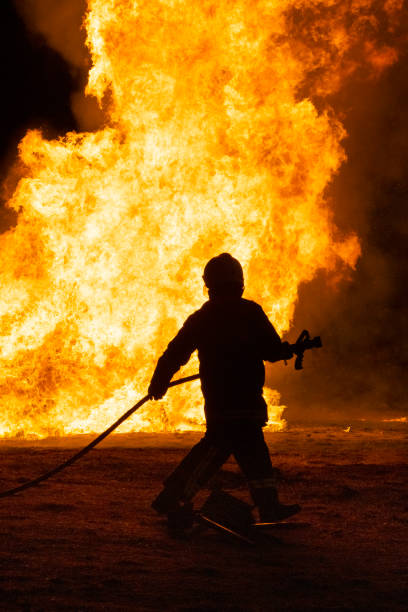 istock Firefighters putting out a fire. Destruction and disaster 1441941081