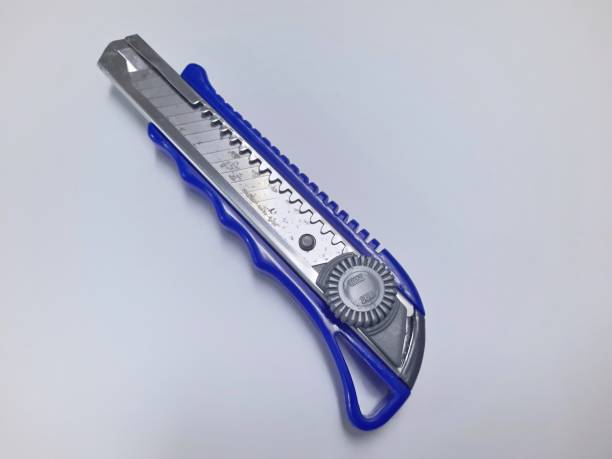 istock Paper cutter knife on white background 1441946015