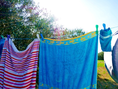 Colorful towels drying outdoors in the sun