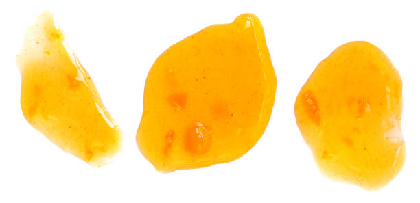 istock Orange fruit  jam isolated on white background, top view. Orange or mandarine confiture  Flat lay 1441948563