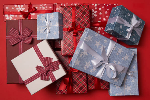 istock Group of gift boxes on red background. 1441950569
