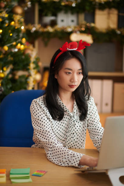 istock Businesswoman Working on Christmas 1441950849