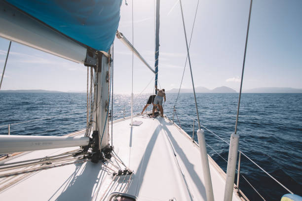 istock Two crew members on sailboat maintain anchor 1441952392