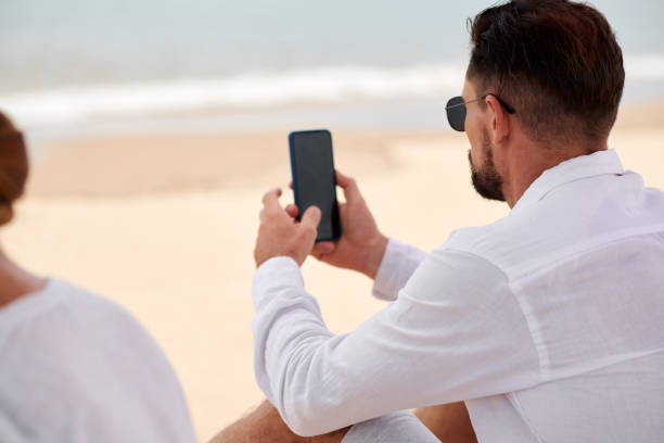 istock Businessman Checking Smartphone 1441955073
