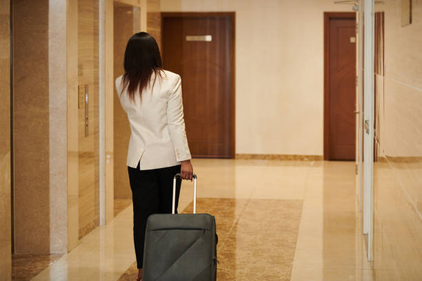 istock Business Tourist Waiting for Elevator 1441955193