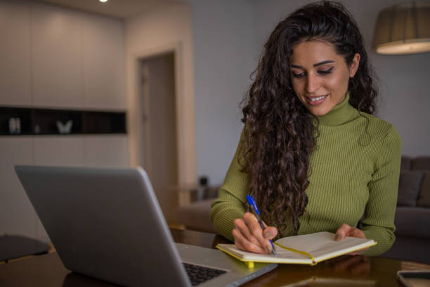 istock Young woman working from home 1441959998