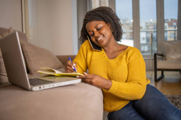 istock Young woman working from home 1441960410