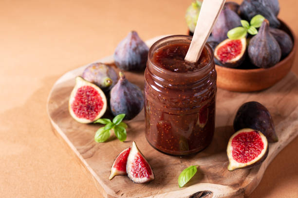 istock Fig jam or fig marmalade on wooden board with fresh, ripe figs 1441963609